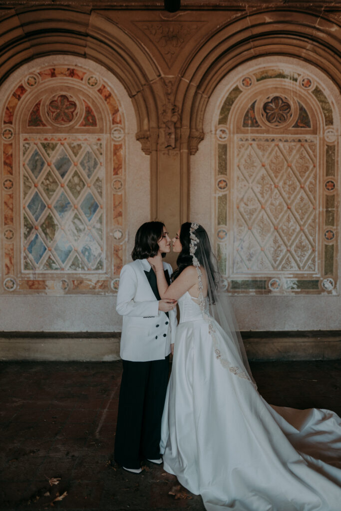 Two brides exchanging vows at Bethesda Terrace Central Park NYC intimate elopement ceremony